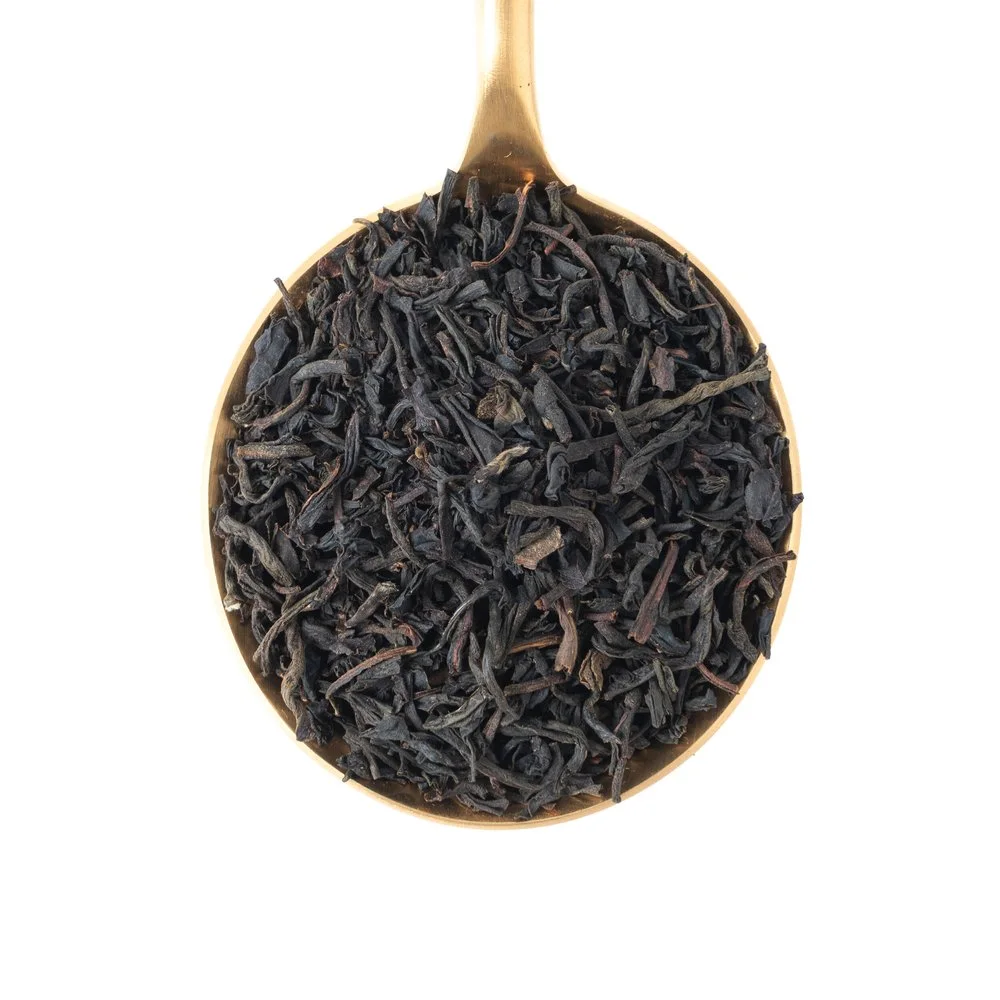 Earl Grey loose-leaf tea on a tasting spoon