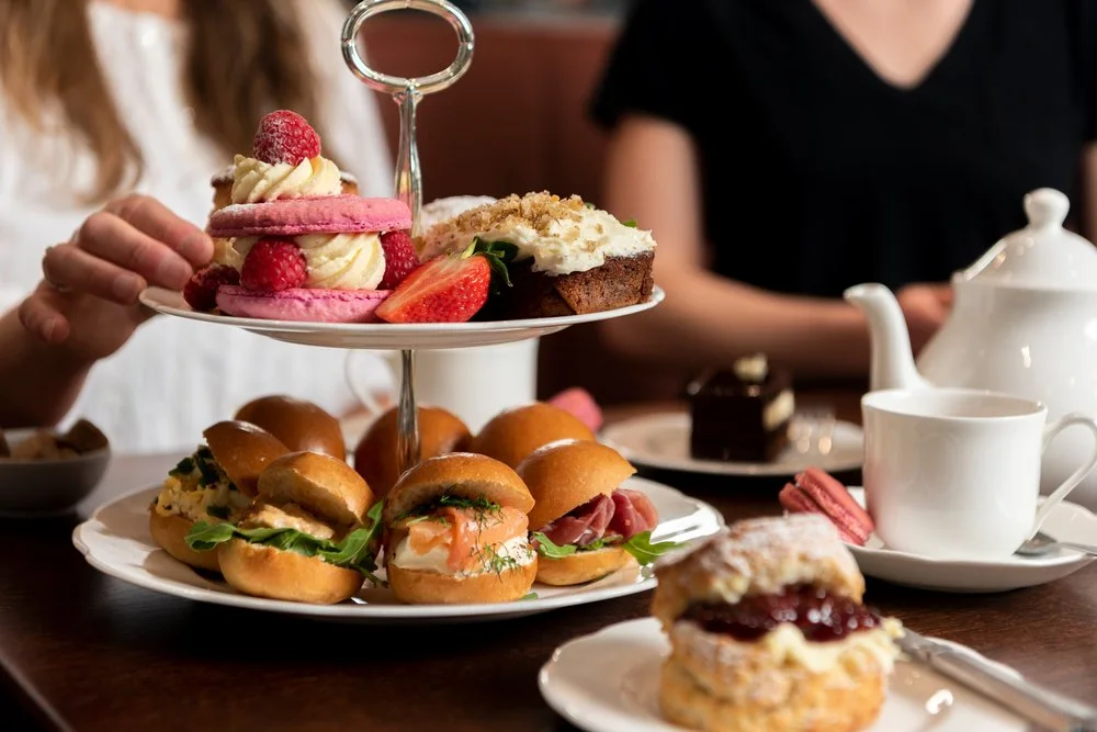 Sandwiches and cakes on the Orange Pekoe afternoon tea stand